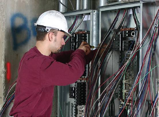 Electrician working on electrical box